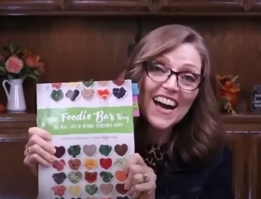 Tami Kramer with The Foodie Bar Way cookbook